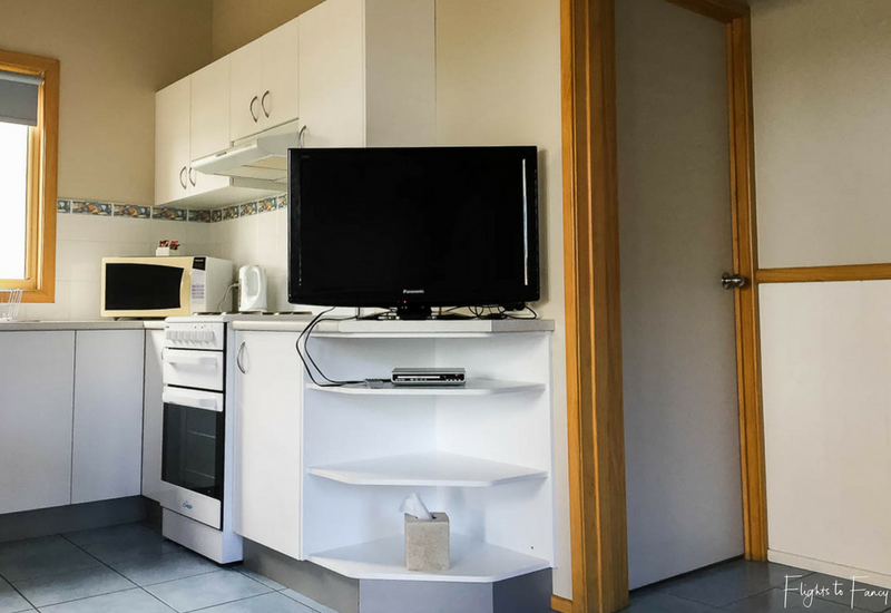 Kitchen in waterfront cabin at Great Lakes Caravan Park Forster