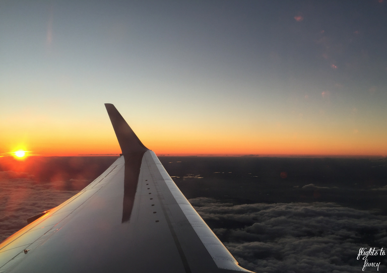 Flights To Fancy: How To Get Cut Price Airline Perks With Optiontown - Plane Window Sunset