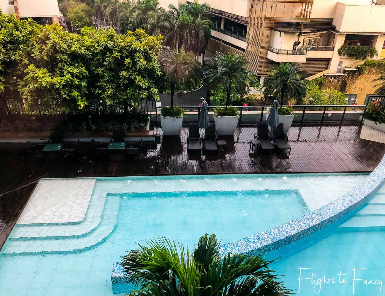 Flights to Fancy - View of the Fairmont Makati pool from room